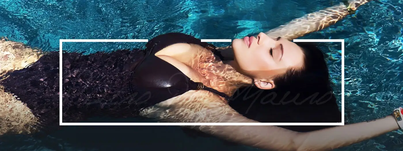 Woman with a perfect body and beautiful face laying in the water - Pietro Di Mauro